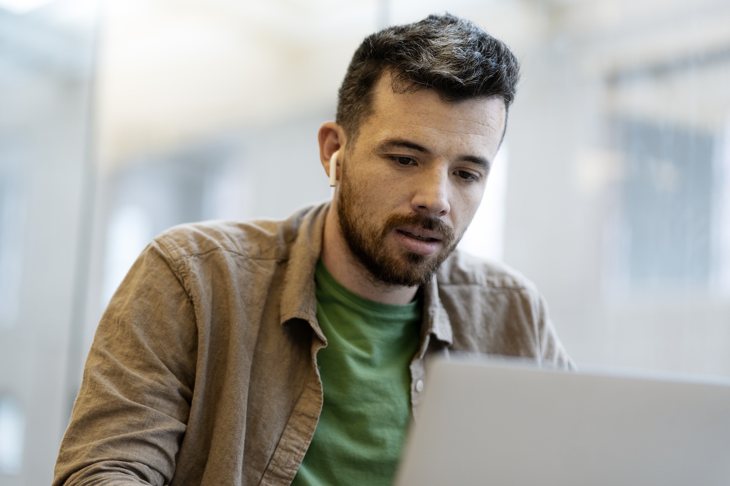 man on his computer trying to find answers to common trt questions