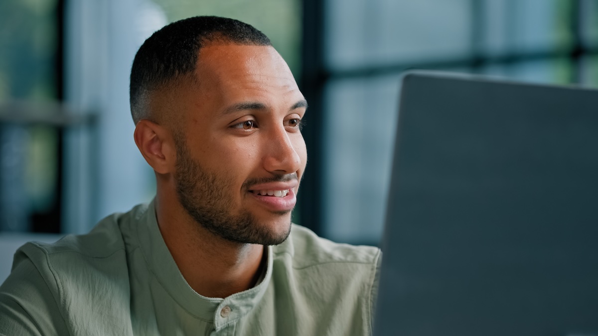 man on computer researching testosterone replacement therapy